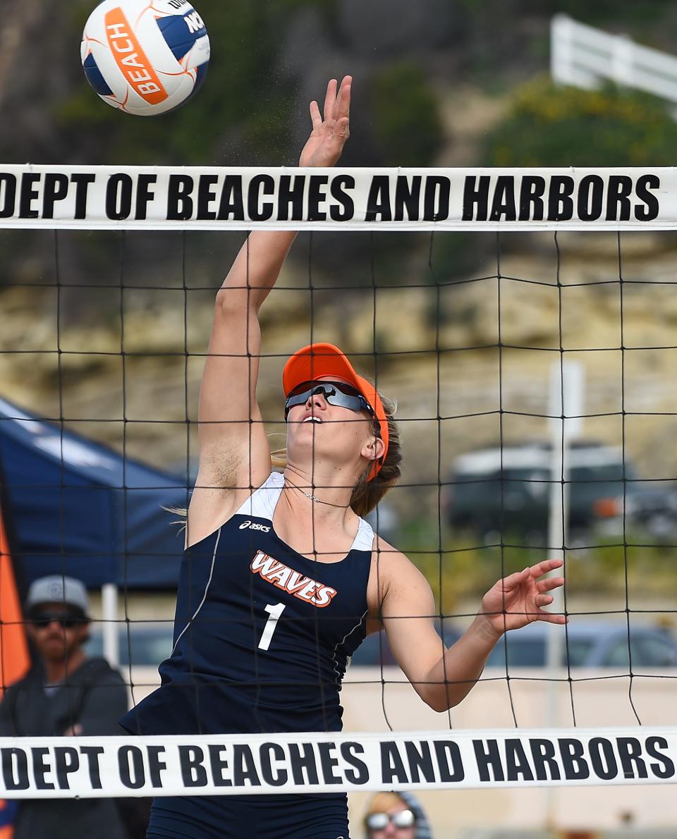 Corinne Quiggle hits the ball for Pepperdine during a college volleyball match against UCLA in 2017.