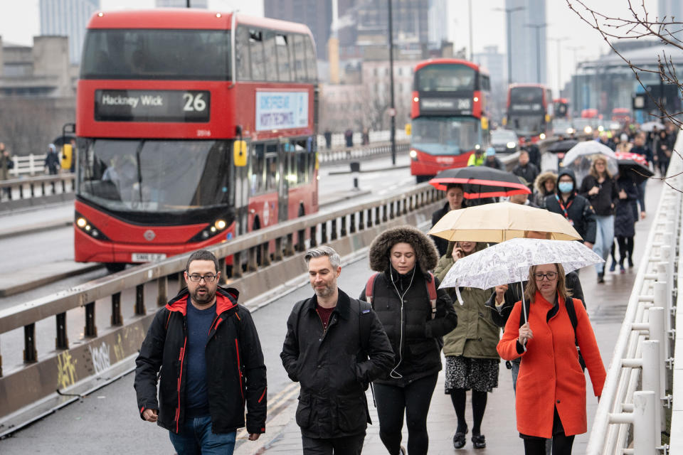 Commuters cross Waterloo Bridge in London, UK