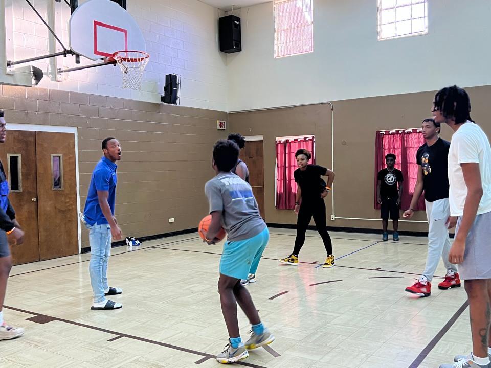 Memphis athletes Javon Ivory, left, Jamirah Shutes, Chandler Lawson and Johnathan Lawson gathered to cheer on kids at St. Paul Baptist Church as part of Mayor Jim Strickland's Safe Summer event.