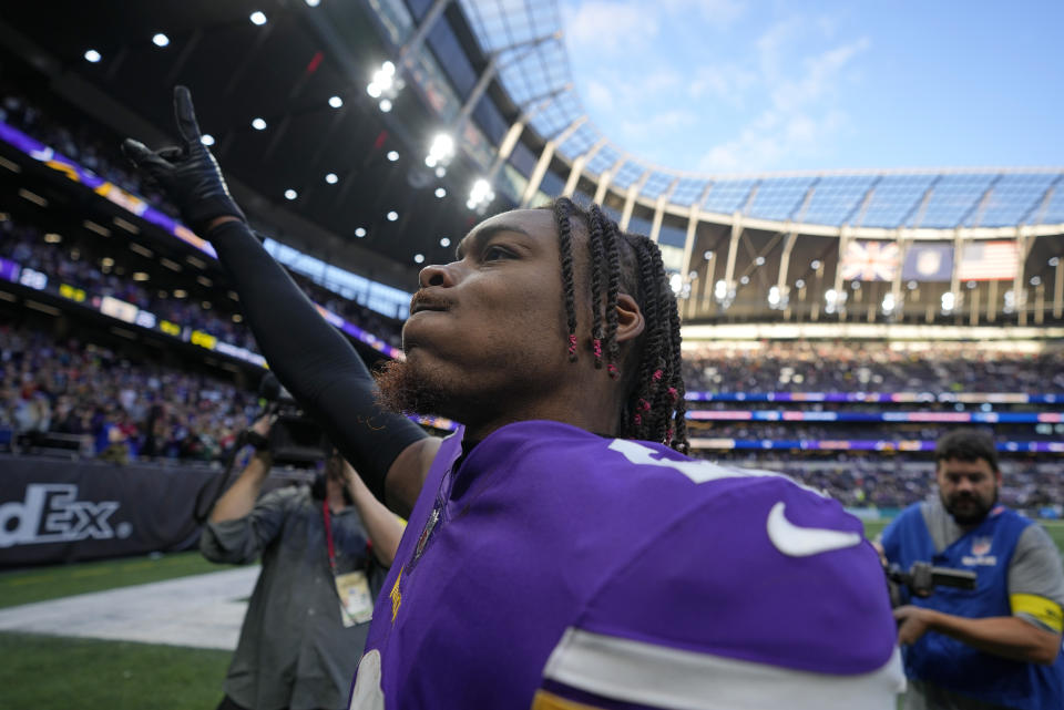 Minnesota Vikings wide receiver Justin Jefferson (18) celebrates after winning an NFL match against New Orleans Saints at the Tottenham Hotspur stadium in London, Sunday, Oct. 2, 2022. The Vikings won the match 28-25. (AP Photo/Frank Augstein)