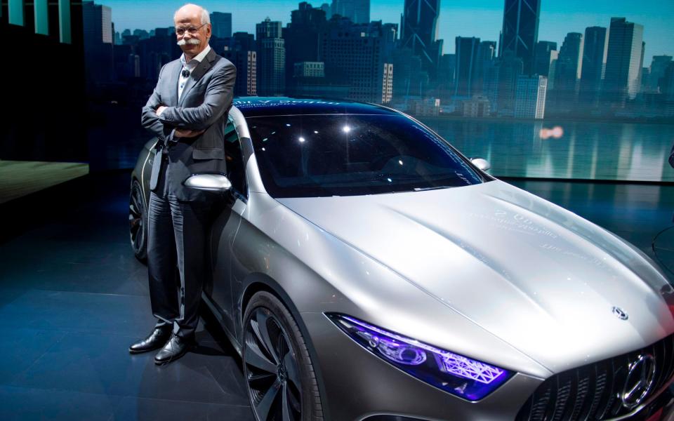 Dieter Zetsche, boss of Mercedes-owner Daimler, poses next to one of the company's concept cars at the Shanghai car show - AFP