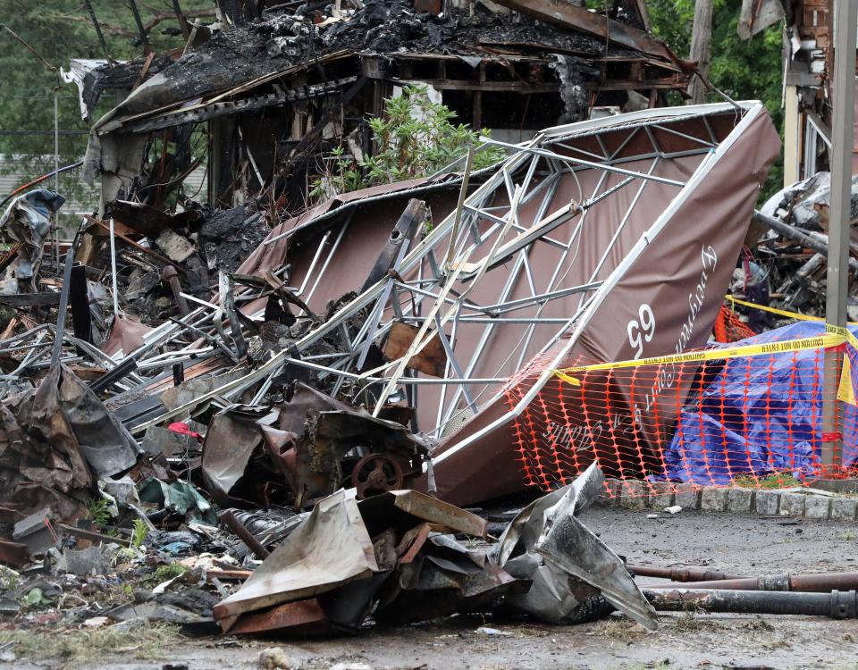 Remains of a building and the entrance canopy at the site of the fatal fire at the Evergreen Court Home for Adults in Spring Valley July 1, 2021.