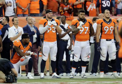 The Broncos' Brandon Marshall, kneeling during the national anthem (AP)