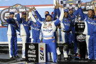 Ricky Stenhouse Jr., center, celebrates in Victory Lane after winning the NASCAR Daytona 500 auto race at Daytona International Speedway, Sunday, Feb. 19, 2023, in Daytona Beach, Fla. (AP Photo/Terry Renna)