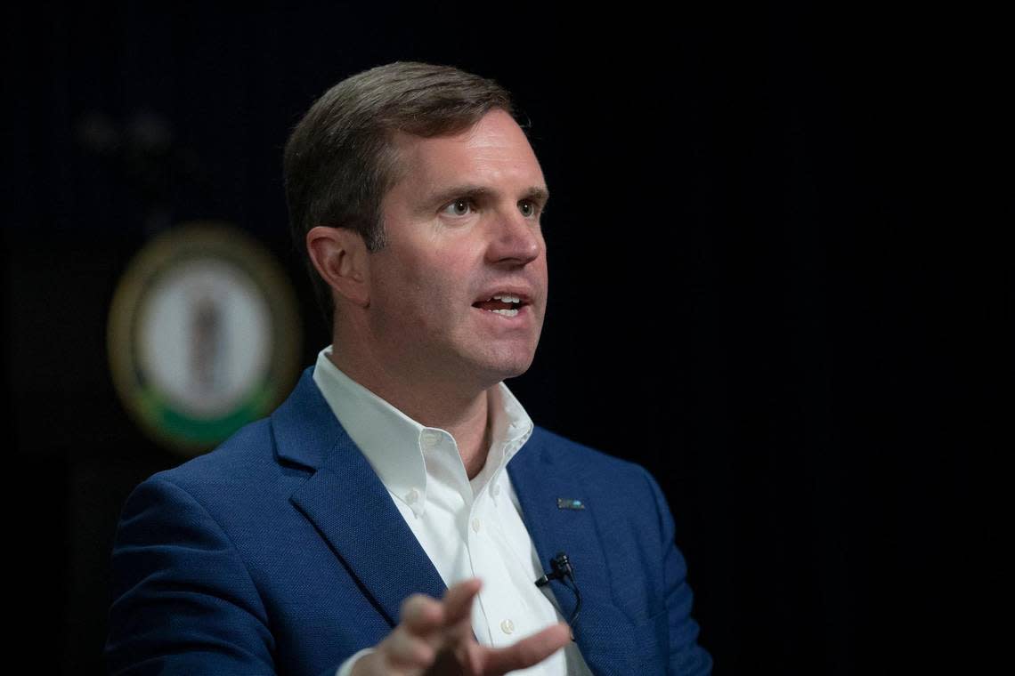 Kentucky Gov. Andy Beshear speaks to a reporter at the state Capitol in Frankfort on Wednesday, Dec. 7, 2022.