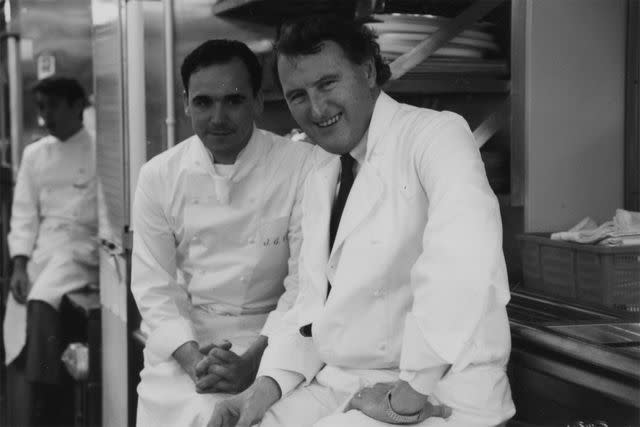 <p>Courtesy of Jean-Georges Restaurants</p> Jean-Georges Vongerichten (left) with his mentor Louis Outhier