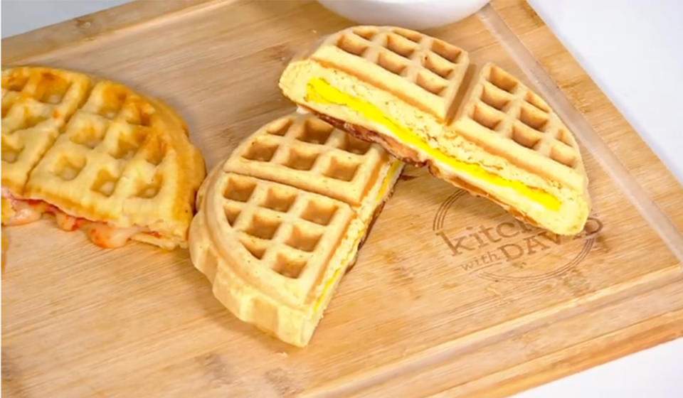 bacon, egg, and cheese stuffed waffle on right, pizza waffle on left