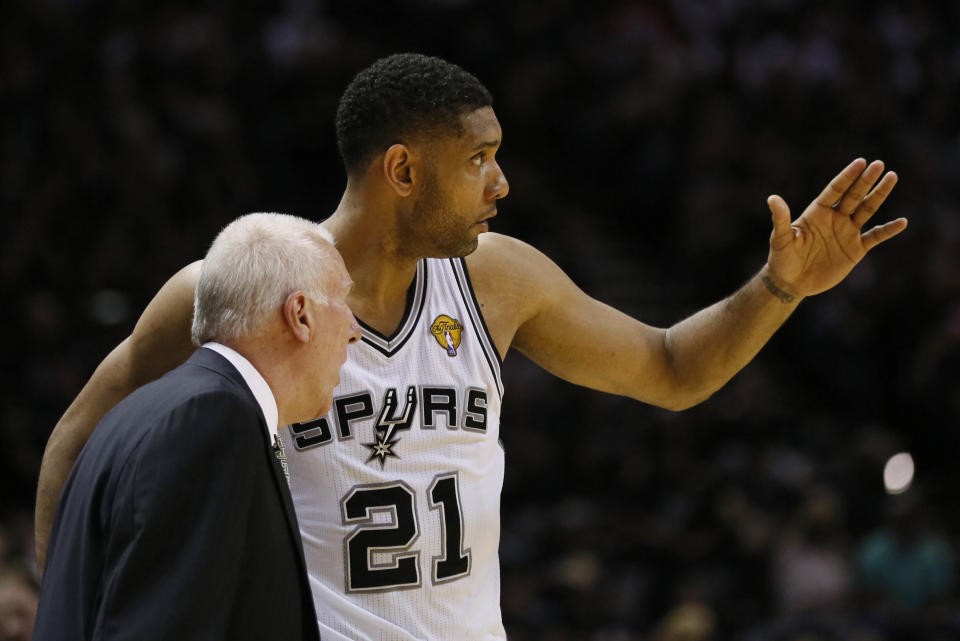 Jun 5, 2014; San Antonio, TX, USA; San Antonio Spurs forward Tim Duncan (21) talks to San Antonio Spurs head coach Gregg Popovich during the first quarter against the Miami Heat in game one of the 2014 NBA Finals at AT&T Center. Mandatory Credit: Soobum Im-USA TODAY Sports