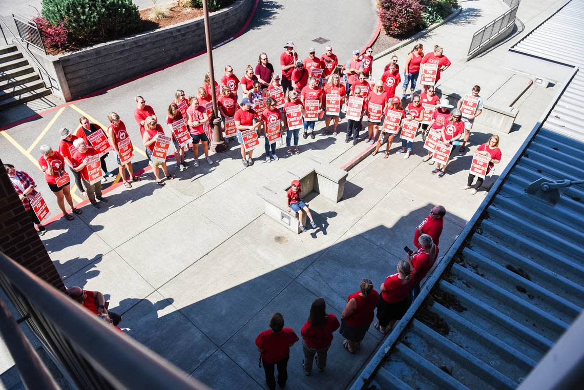 Eatonville Education Association members participate in a silent vigil outside the Eatonville School District Office on Thursday, Sept. 1, 2022. The union has authorized a strike beginning Wednesday, Sept. 7, if a labor dispute is not resolved.