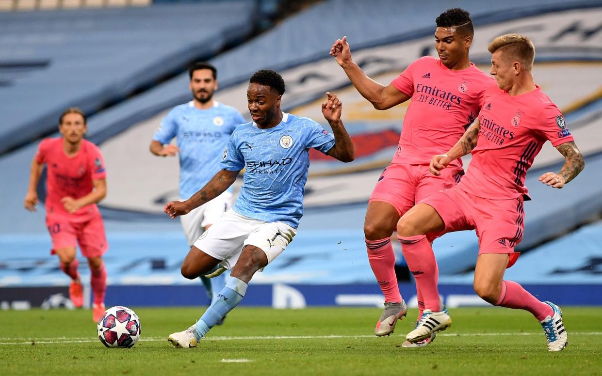 Raheem Sterling of Manchester City is challenged by Casemiro and Toni Kroos of Real Madrid during the UEFA Champions League - Getty Images