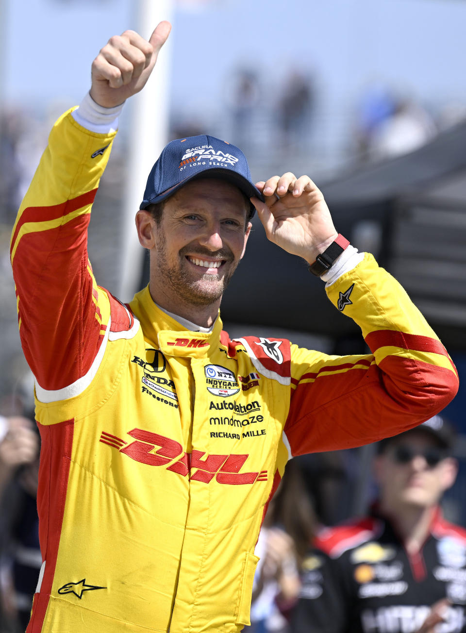 Second place finisher Romain Grosjean acknowledges the crowd in victory lane following the 47th annual Acura Grand Prix of Long Beach on Sunday, April 10, 2022. Josef Newgarden won the race. (Will Lester/The Orange County Register via AP)