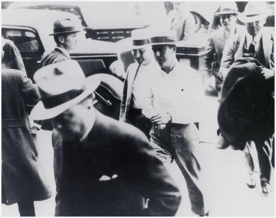 FBI Director J. Edgar Hoover, left, after the arrest of Alvin Karpis in New Orleans on May 1, 1936.