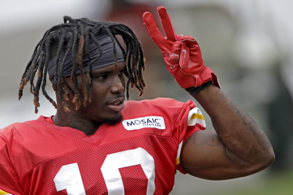 Kansas City Chiefs wide receiver Tyreek Hill waves to fans before NFL football training camp Monday, July 29, 2019, in St. Joseph, Mo. (AP Photo/Charlie Riedel)