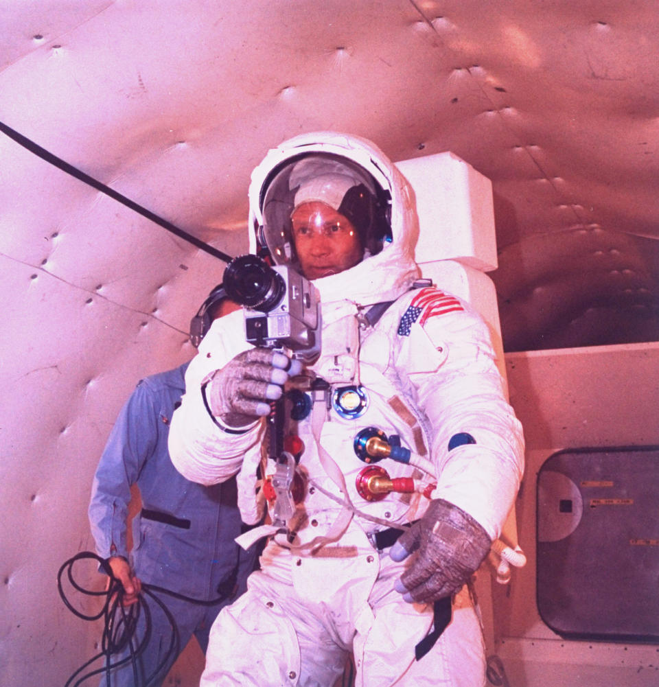 Astronaut Edwin 'Buzz' Aldrin in space suit, practicing with a movie camera he would use on the&nbsp;Apollo XI (11) lunar mission.