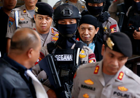 Islamic cleric Aman Abdurrahman arrives at a court ahead of his verdict in Jakarta, Indonesia, June 22, 2018. REUTERS/Darren Whiteside