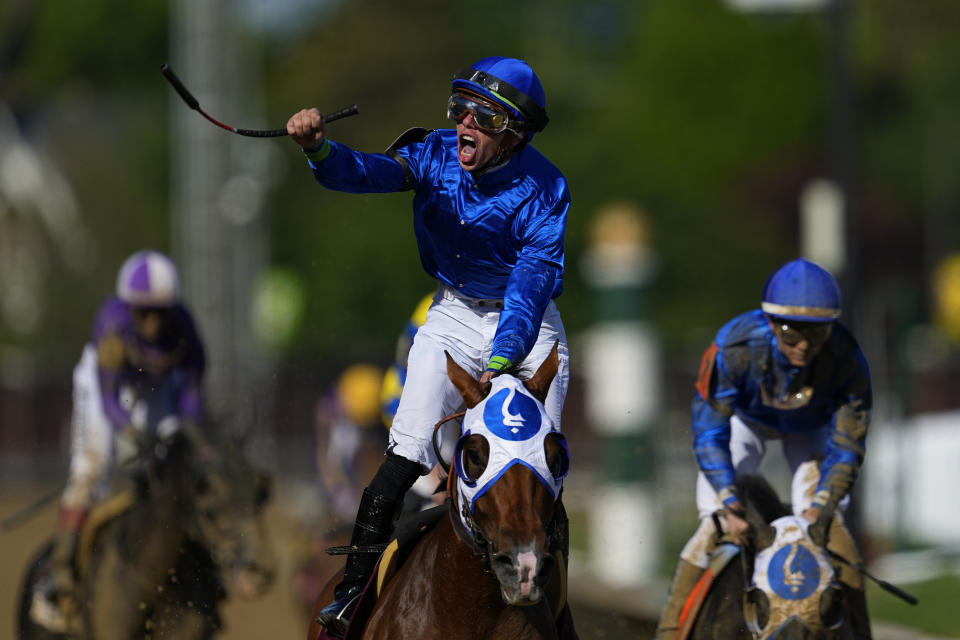 Tyler Gaffalione riding Pretty Mischievous celebrates after winning the 149th running of the Kentucky Oaks horse race at Churchill Downs Friday, May 5, 2023, in Louisville, Ky. (AP Photo/Julio Cortez)