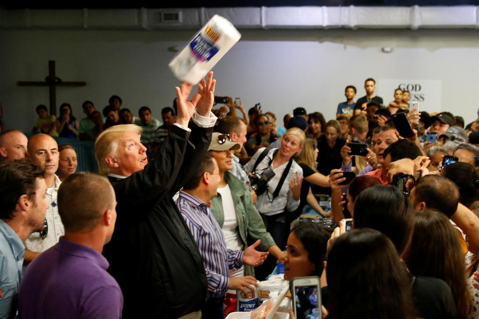 President Donald Trump tosses rolls of paper towels to people at a hurricane relief distribution center in San Juan, Puerto Rico, on Oct. 3, 2017.&nbsp; (Photo: Jonathan Ernst / Reuters)