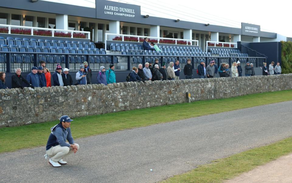 Rafa Cabrera Bello lines up a shot from the road on the 17th hole during day one of the Alfred Dunhill Links Championship 2024 at the Old Course at St Andrews on October 3, 2024 in St Andrews, Scotland.