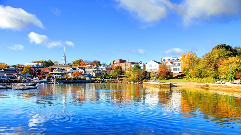 Camden, Maine during autumn as seen from blue waters on a sunny day