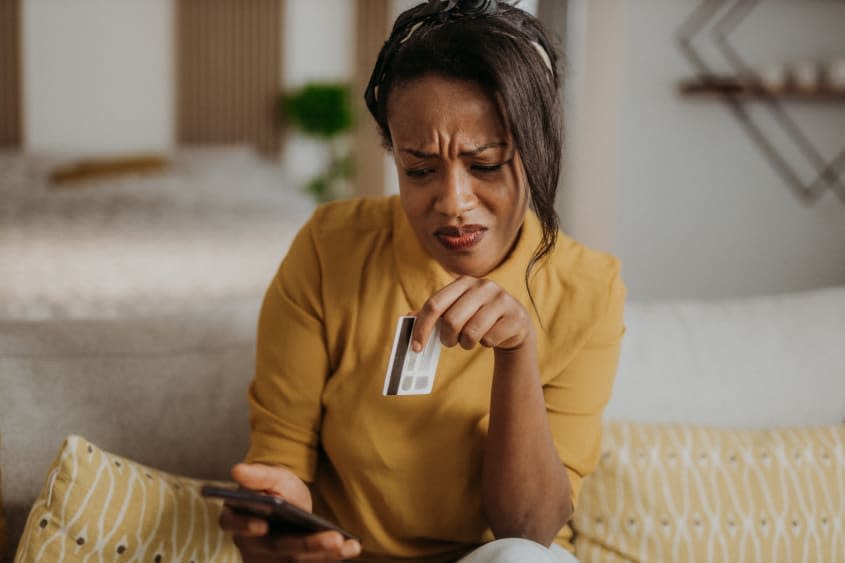 A woman with a credit card.