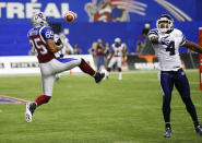 Montreal Alouettes Brian Bratton (L) misses a catch in the endzone as Toronto Argonauts Pacino Horne defends him during the second half of CFL's Eastern Conference Final football game in Montreal, November 18, 2012. REUTERS/Mathieu Belanger (CANADA - Tags: SPORT FOOTBALL) 
