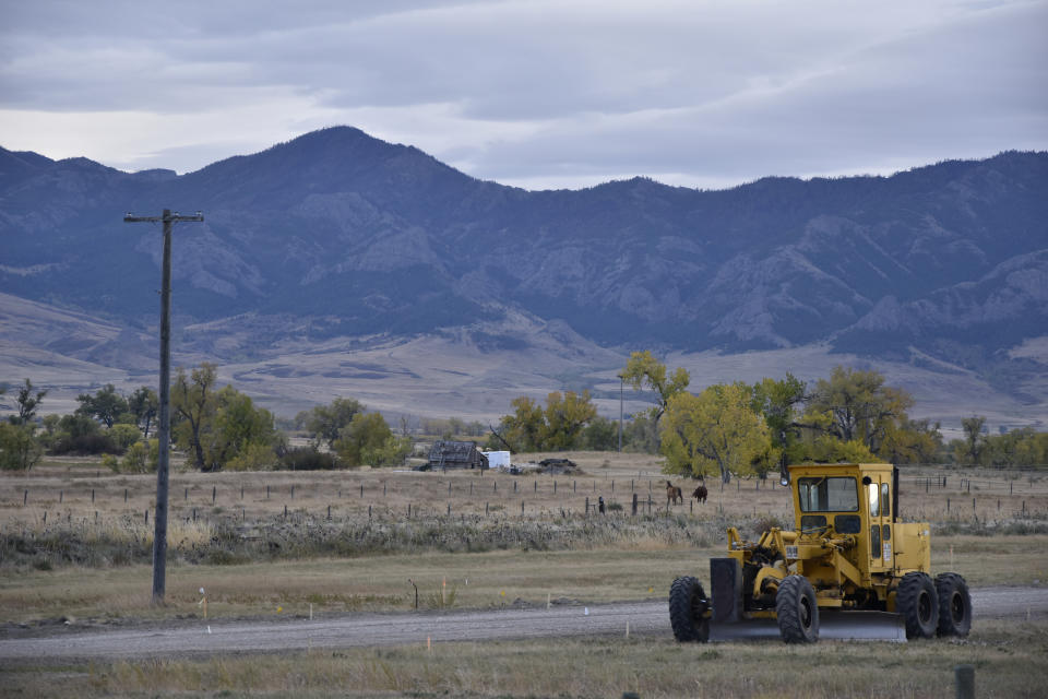 FILE - Farmland and ranches are seen on the outskirts of Cascade, Mont., on Oct. 15, 2021. Incorporated 110 years ago, Cascade has changed little since then, aside from a recent upgrade of the town's water and sewage pipes. A new map dividing Montana into two congressional districts for the first time in three decades was finalized Tuesday, Nov. 9, 2021, triggering disappointment from Democrats who hoped to craft a different western district that would give them a better chance of winning in an increasingly Republican-dominated state. (AP Photo/Iris Samuels, File)