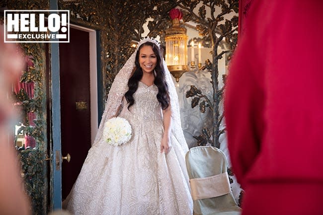 Rebecca Ferguson looking stunning in her wedding dress whilst holding her bouquet