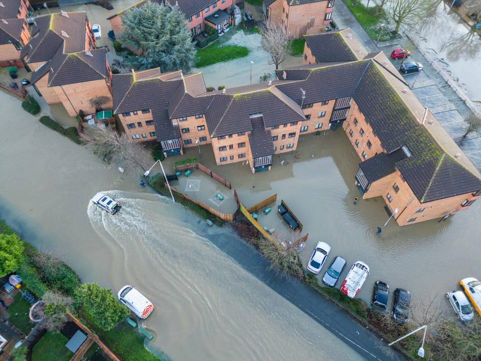 Cars parked outside homes in Loughborough, Leicestershire, were left submerged in floodwater from the Grand Union Canal. (SWNS)