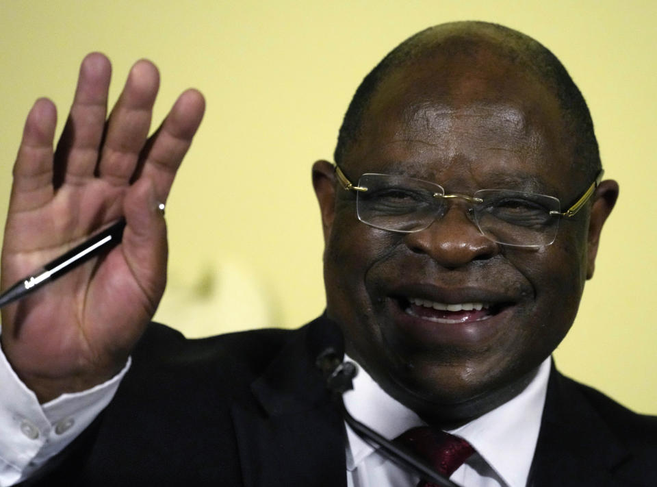 Chief Justice Raymond Zondo gestures during the handing over of the final report of a judicial investigation into corruption to the South Africa's President Cyril Ramaphosa, at Union Building in Pretoria, South Africa, Wednesday, June 22, 2022. The probe has laid bare the rampant corruption in government and state-owned companies during former President Jacob Zuma’s tenure from 2009 to 2018. (AP Photo/Themba Hadebe)