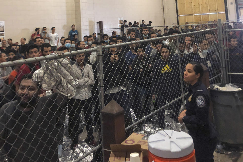People forced to stand in small, enclosed spaces at a detention center in McAllen, Texas, during a visit by Vice President Mike Pence. (Photo: ASSOCIATED PRESS)