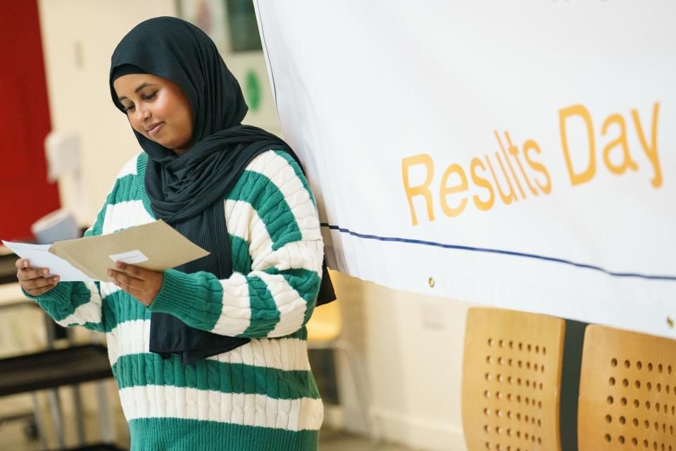 Naima Mohamoud receives her A-level results at Oasis Academy Hadley, Enfield, north London (PA)