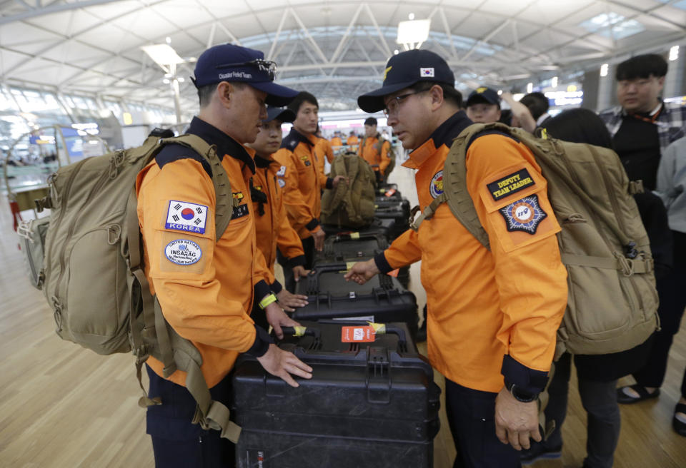 South Korean rescue team members prepare to board a plane to leave for Budapest at Incheon International Airport in Incheon, South Korea, Thursday, May 30, 2019. A massive search is underway on the Danube River in downtown Budapest for over a dozen people missing after a sightseeing boat with 33 South Korean tourists sank after colliding with another vessel during an evening downpour. (AP Photo/Ahn Young-joon)