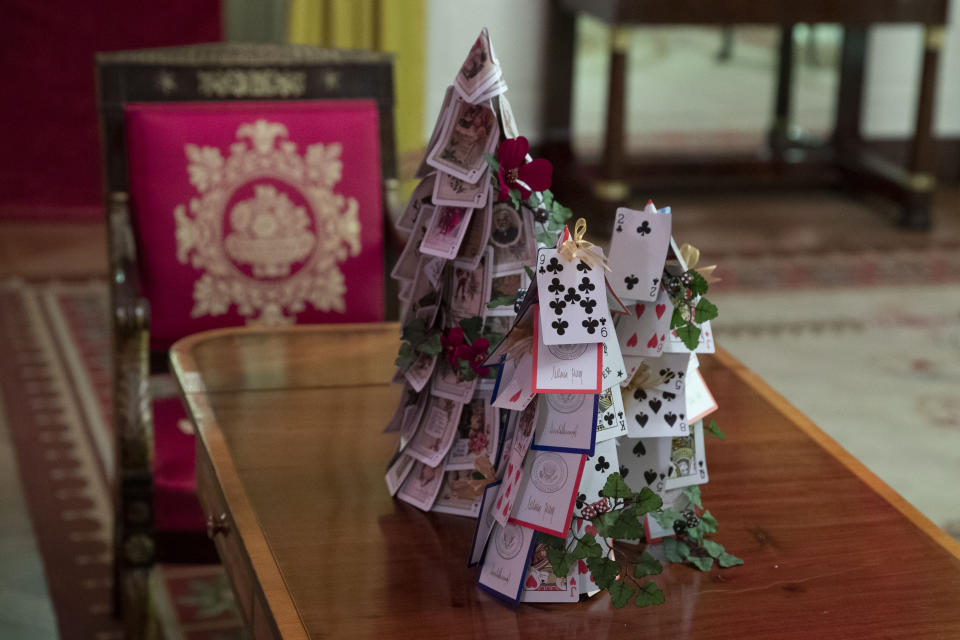 The Red Room is decorated with games, including a tree made of White House playing cards during the 2019 Christmas preview at the White House, Monday, Dec. 2, 2019, in Washington. (AP Photo/Alex Brandon)