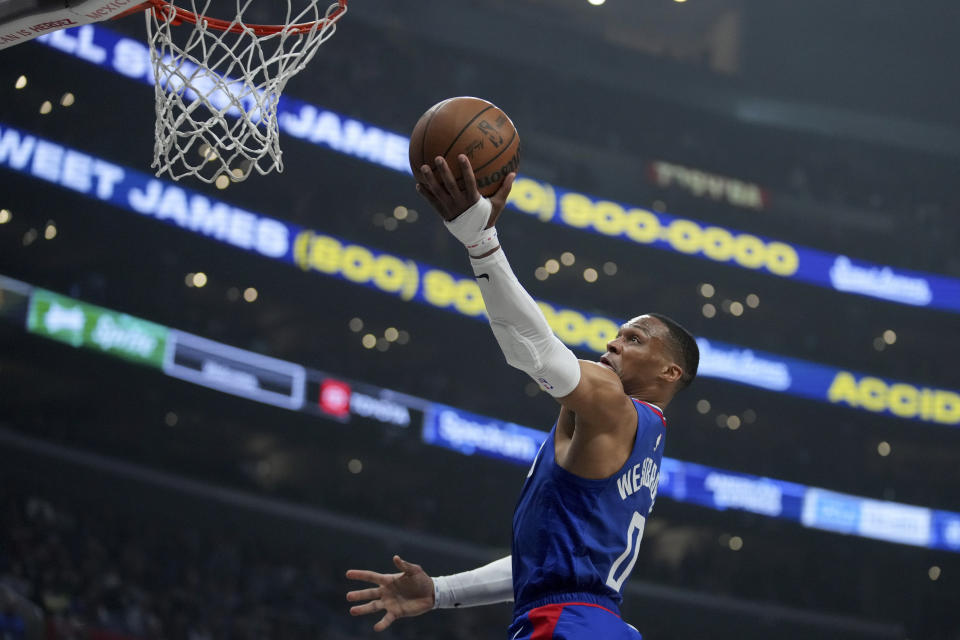 Los Angeles Clippers guard Russell Westbrook drives to the basket during the first half of the team's NBA basketball game against the Utah Jazz in Los Angeles, Friday, April 12, 2024. (AP Photo/Eric Thayer)