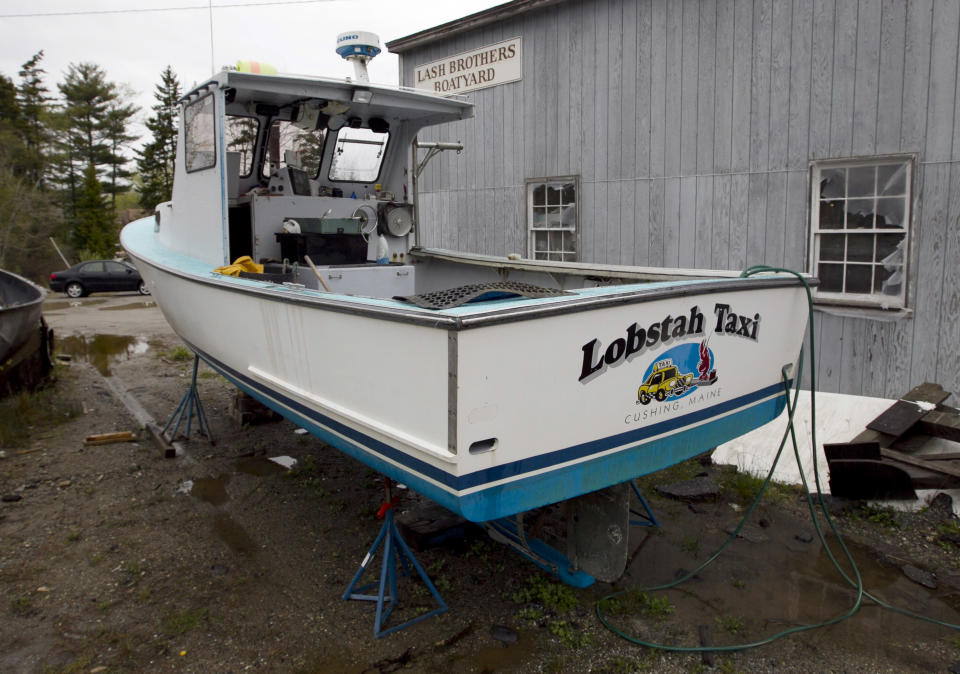 One of the two lobster boats recently sunk by vandals is seen in a boatyard in Friendship, Maine, Thursday, May 10, 2012. The sinkings are bringing back memories of territorial tensions in the industry that led to a shooting two summers ago. (AP Photo/Robert F. Bukaty)