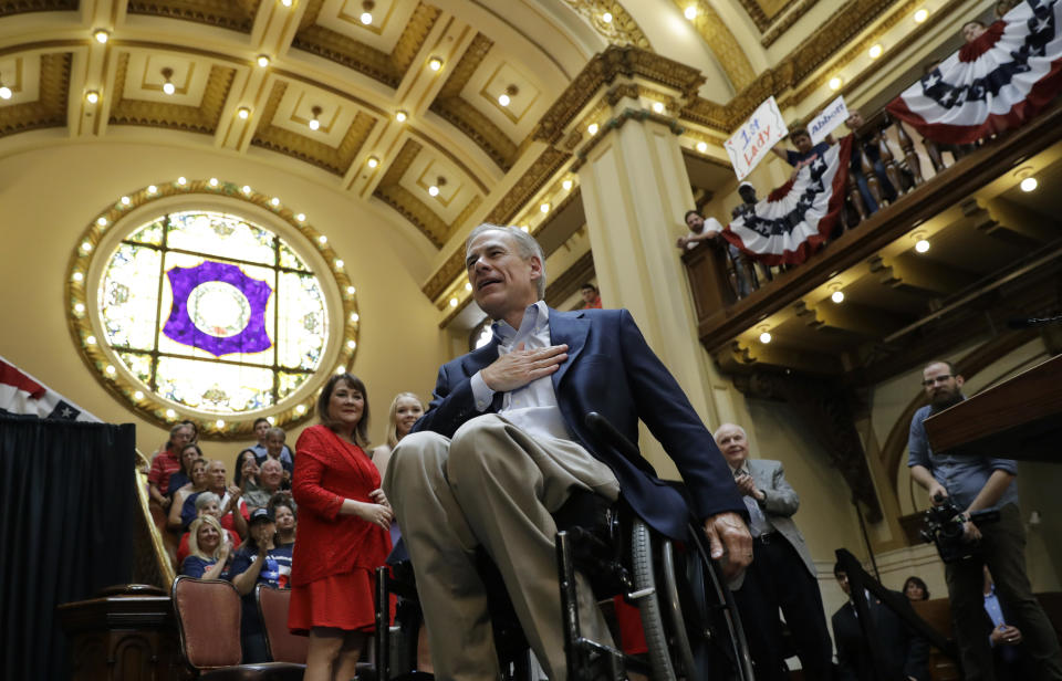 Texas Gov. Greg Abbott gestures to supporters as he and his wife, Cecilia, arrive for an event where he announced his bid for reelection in July 2017, in San Antonio. (Photo: Eric Gay/AP)