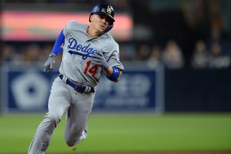 FILE PHOTO: May 3, 2019; San Diego, CA, USA; Los Angeles Dodgers second baseman Enrique Hernandez (14) advances to third base on a double by first baseman Cody Bellinger (not pictured) against the San Diego Padres during the sixth inning at Petco Park. Mandatory Credit: Jake Roth-USA TODAY Sports