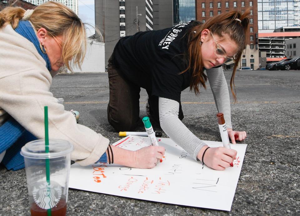 Hannah-Kate Williams organizes a gathering in front of the  Southern Baptist Convention building in Nashville, Monday, Feb. 21, 2022. Williams is among a group of activists who continue to call for better policies in the convention to prevent sexual abuse in churches.