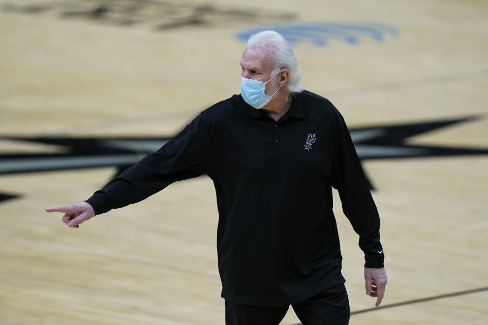 San Antonio Spurs coach Gregg Popovich walks off the court after he was ejected during the first half of the team's NBA basketball game against the Los Angeles Lakers in San Antonio, Wednesday, Dec. 30, 2020. (AP Photo/Eric Gay)