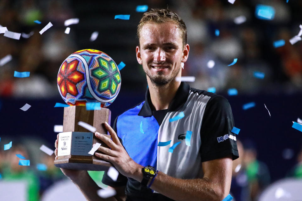 Daniil Medvedev (pictured) smiles and celebrates with the trophy after winning the Los Cabos Open.