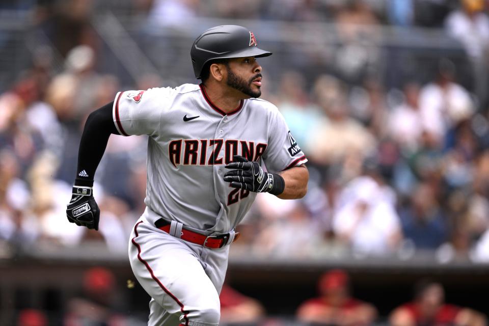 Arizona Diamondbacks designated hitter Tommy Pham (28) hits a triple against the San Diego Padres during the third inning at Petco Park.