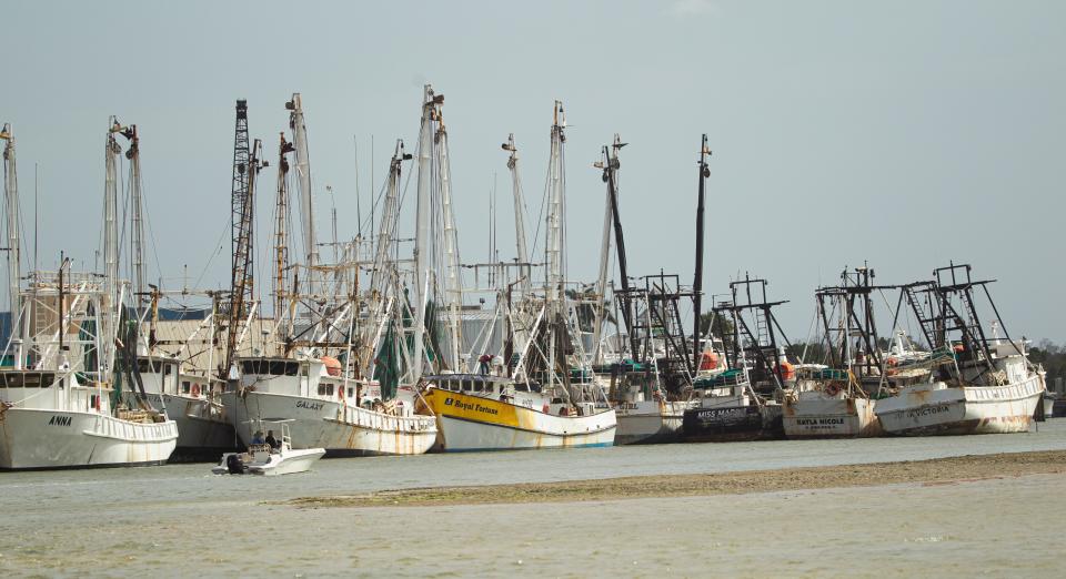 Boats move through Matanzas Pass on the San Carlos Island of Fort Myers Beach on Tuesday, Feb. 13, 2024.