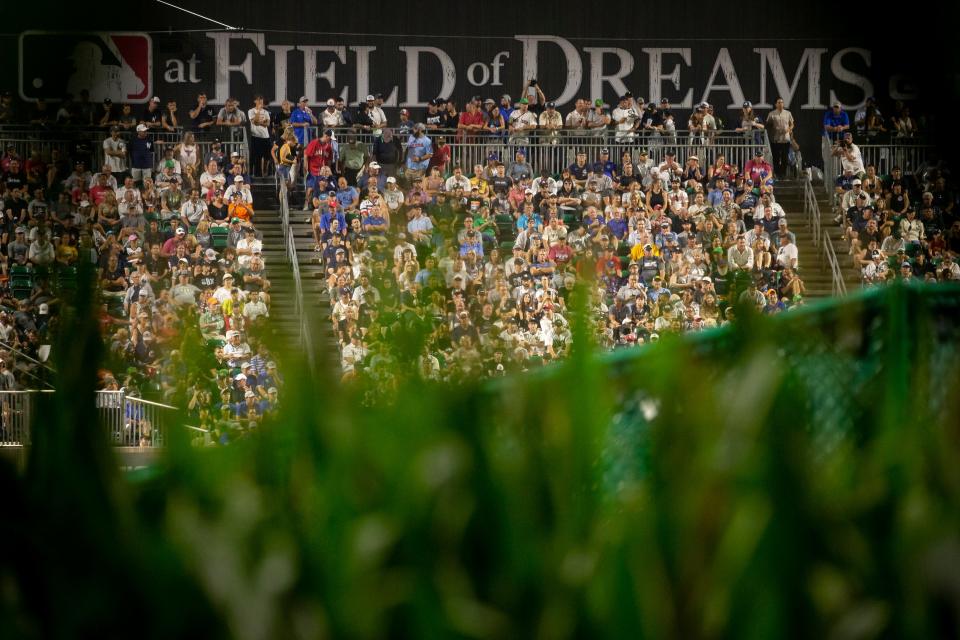 Fans watch as the Chicago White Sox take on the New York Yankees during their baseball game at the new MLB field next to the "Field of Dreams" movie site on Thursday, Aug. 12, 2021, in Dyersville, Iowa. The Chicago White Sox would go on to defeat the New York Yankees 9-8 thanks to a two-run walk-off home run by Tim Anderson.