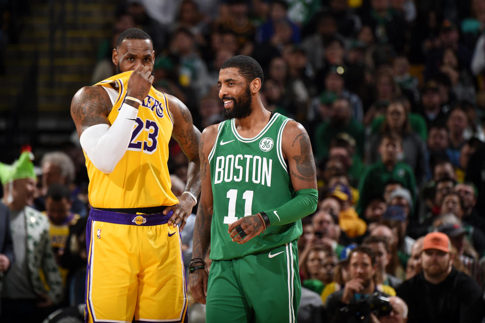 BOSTON, MA - FEBRUARY 7: LeBron James #23 of the Los Angeles Lakers and Kyrie Irving #11 of the Boston Celtics talk during the game on February 7, 2019 at the TD Garden in Boston, Massachusetts. NOTE TO USER: User expressly acknowledges and agrees that, by downloading and/or using this photograph, user is consenting to the terms and conditions of the Getty Images License Agreement. Mandatory Copyright Notice: Copyright 2019 NBAE (Photo by Brian Babineau/NBAE via Getty Images)