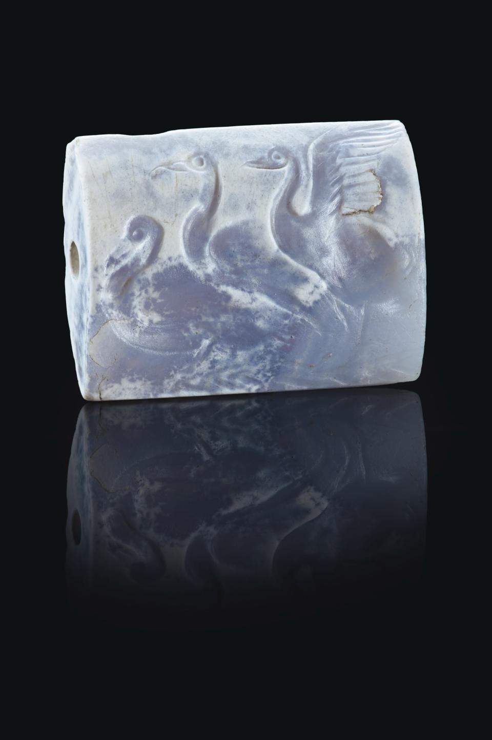 A Minoan blue chalcedony tabloid seal with three swans dates back to around the 16th century B.C.E.