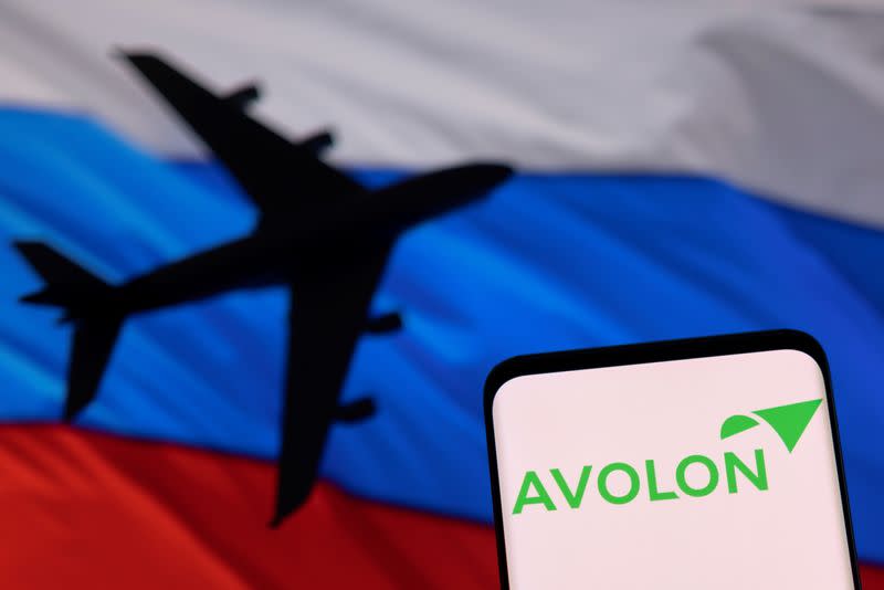 Illustration shows Avolon logo displayed in front of the model of an airplane and a Russian flag