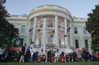 <p>President Donald Trump and first lady Melania Trump hand out treats as they welcome children from the Washington area and children of military families to trick-or-treat celebrating Halloween at the South Lawn of the White House in Washington, Oct. 30, 2017. (Photo: Pablo Martinez Monsivais/AP) </p>