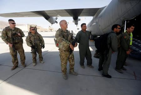 U.S. and Afghan air crew prepare for a flight at the Kabul military airport in Kabul, Afghanistan July 9, 2017. Picture taken on July 9, 2017. REUTERS/Omar Sobhani