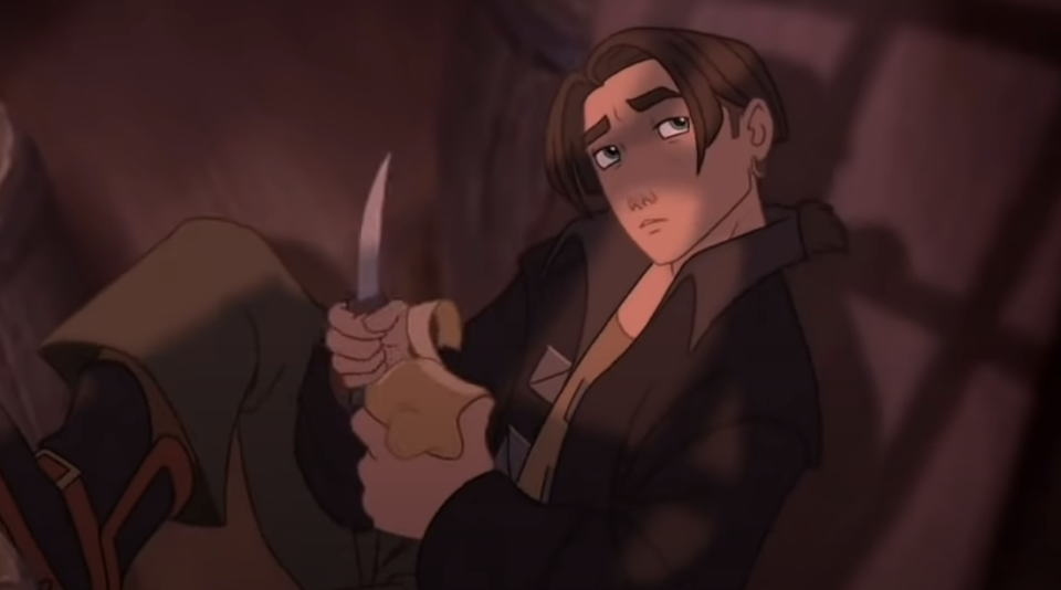 a character using his knife to carve wood