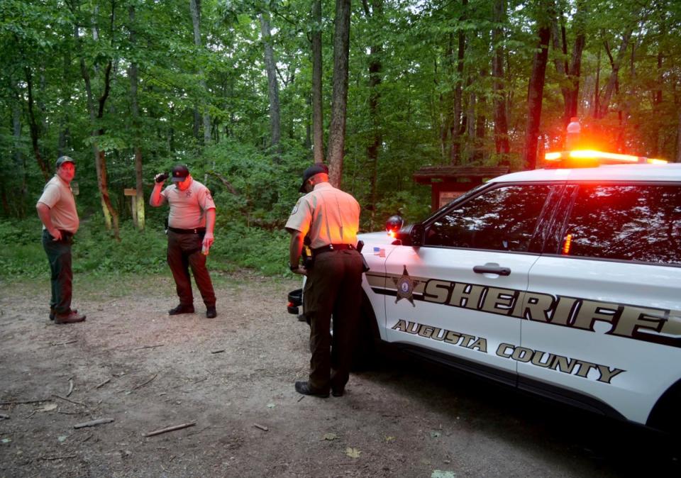 Authorities secure the entrance to Mine Bank Trail, an access point to the rescue operation along the Blue Ridge Parkway where a Cessna Citation crashed over mountainous terrain (AP)